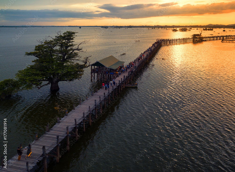 Aerial view from the drone, U Bein bridge crossing that spans the Taungthaman Lake near Amarapura in Myanmar