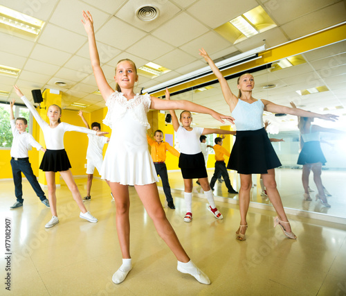 Children learn dance movements in dance class