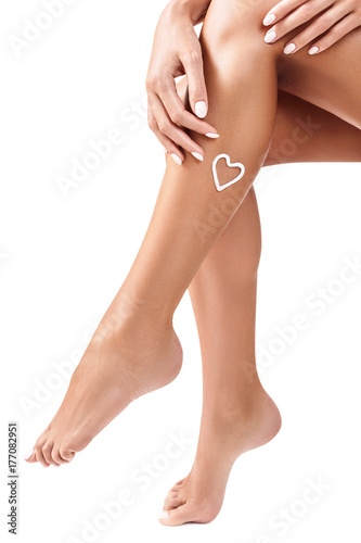 Woman has cream on her leg.