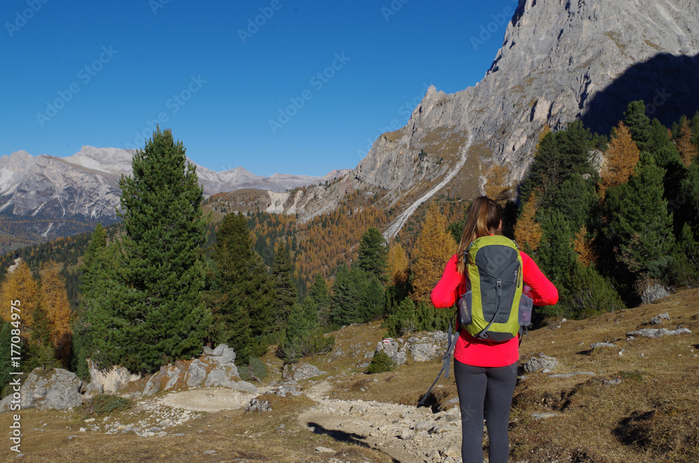 Woman walking on a stunning trekking trail