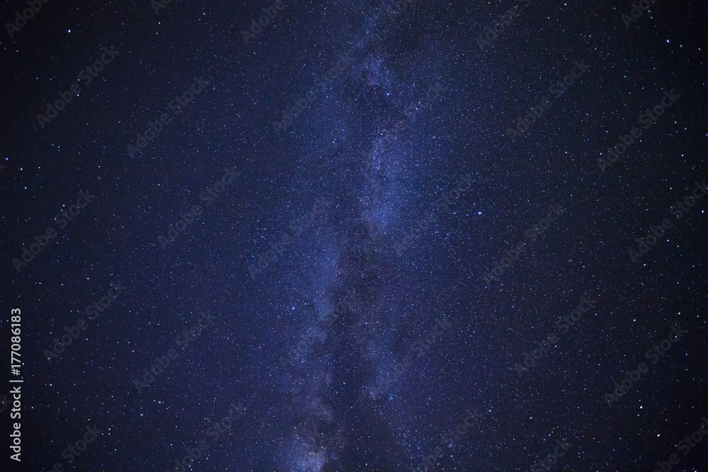 Milky way galaxy with stars and space dust in the universe, Long exposure photograph, with grain.