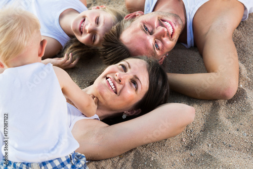 View from above on glad family with children