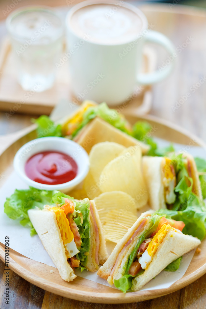 Club sandwich with mocha on the table Club sandwich with mocha on the table
