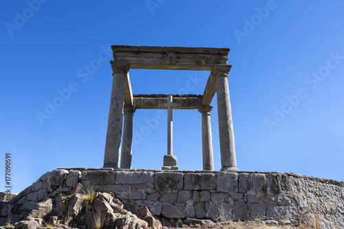 The Four Post made famous by St. Teresa, is outside the walled city of Avila. A cross marks the spot where, St. Teresa's uncle stopped her from running off to battle with the Moors. Avila, Spain.