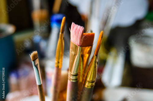 Different paint brushes in art studio