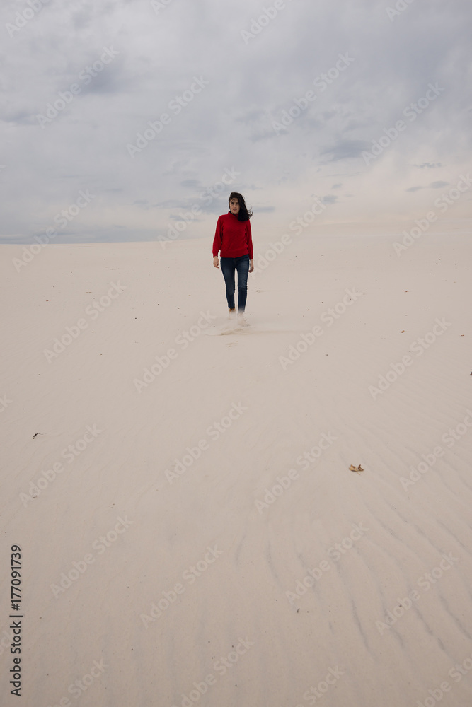 Lonely girl, with flying hair, goes through the desert Lonely girl, with flying hair, goes through the desert
