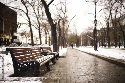 bench in a cold winter park snow © kichigin19
