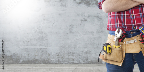 worker and professional builder with tools
