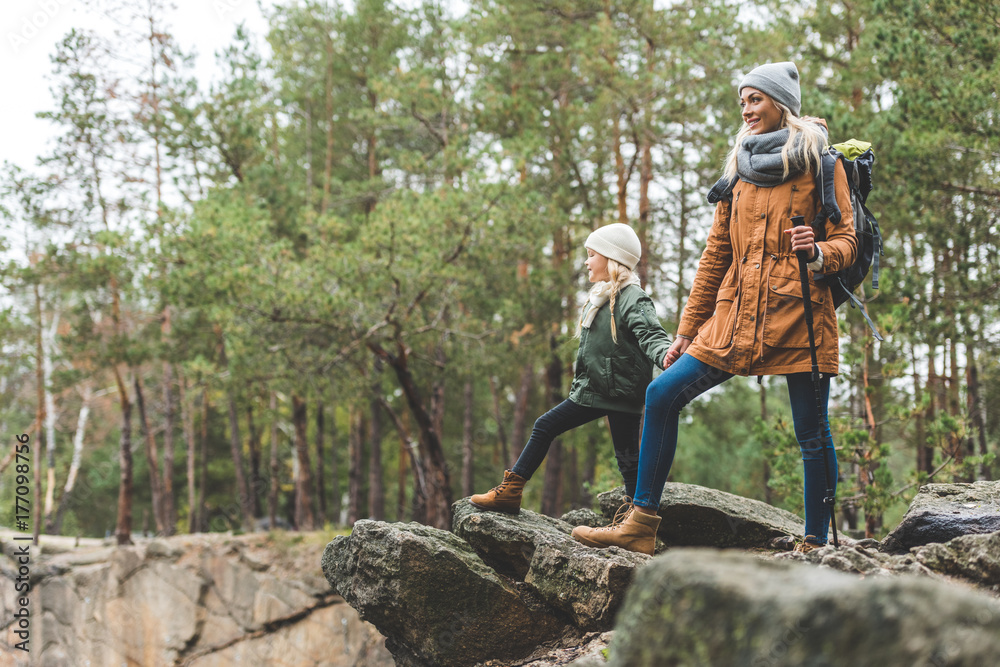 mother and daughter trekking together