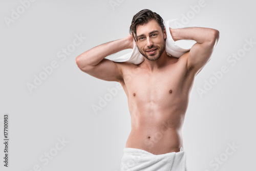 shirtless man with wet hair