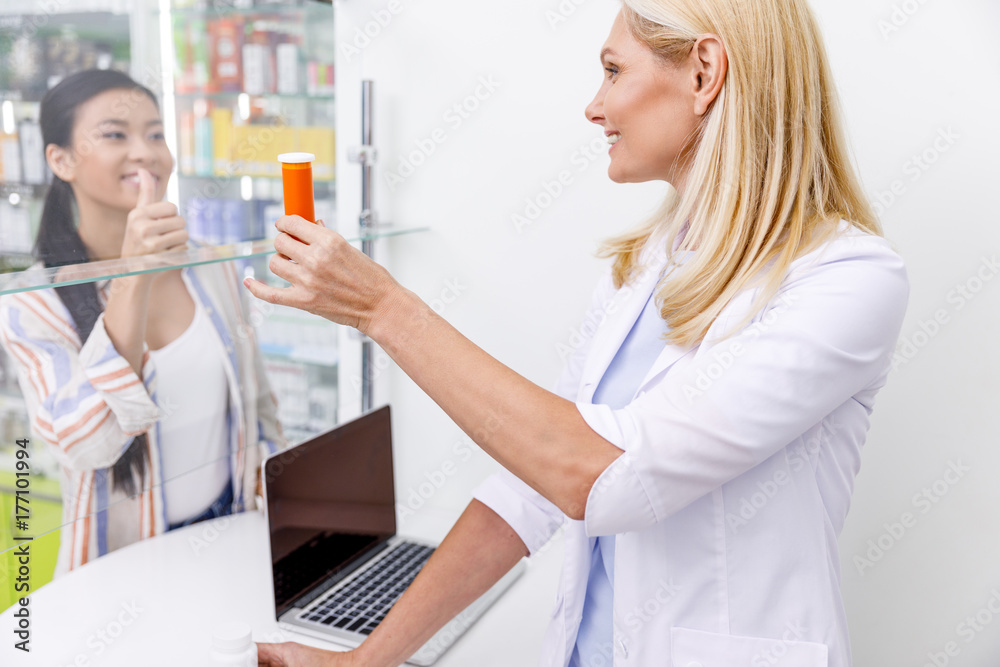 pharmacist and customer in drugstore pharmacist and customer in drugstore