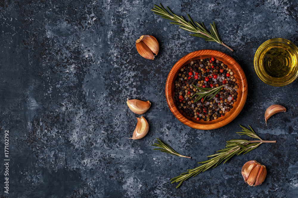 Dark food background with rosemary, garlic and pepper. Dark food background with rosemary, garlic and pepper.