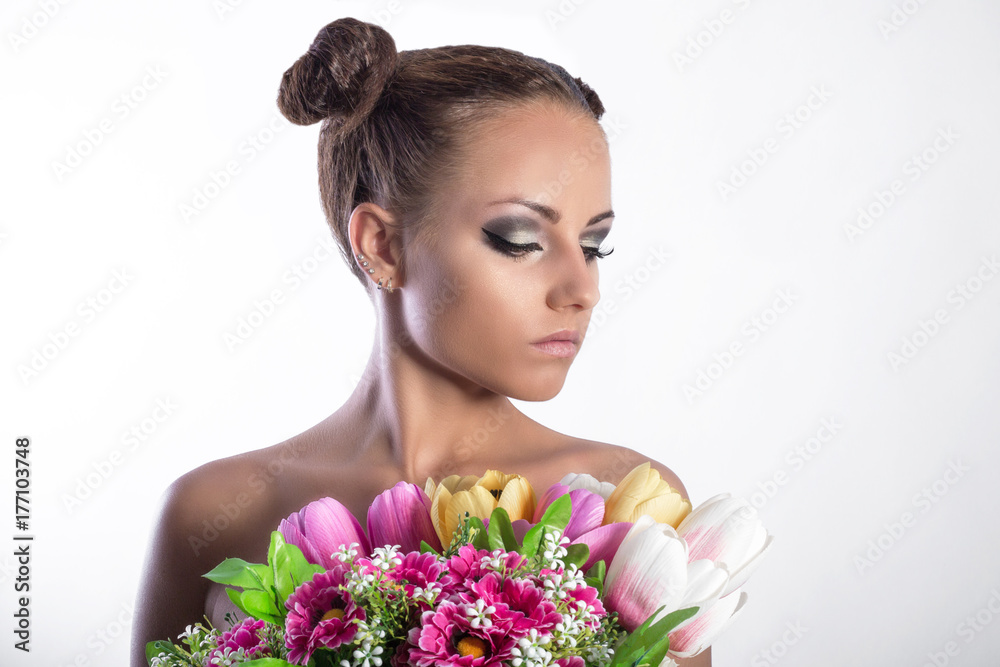beauty woman with spring flowers studio