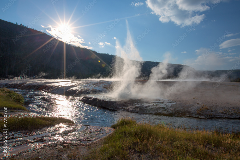 Iron Spring Creek and Cliff Geyser in Black Sand Geyser Basin in Yellowstone National Park in Wyoming United States Iron Spring Creek and Cliff Geyser in Black Sand Geyser Basin in Yellowstone National Park in Wyoming United States