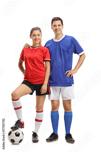Fototapeta Naklejka Na Ścianę i Meble -  Female and a male footballers