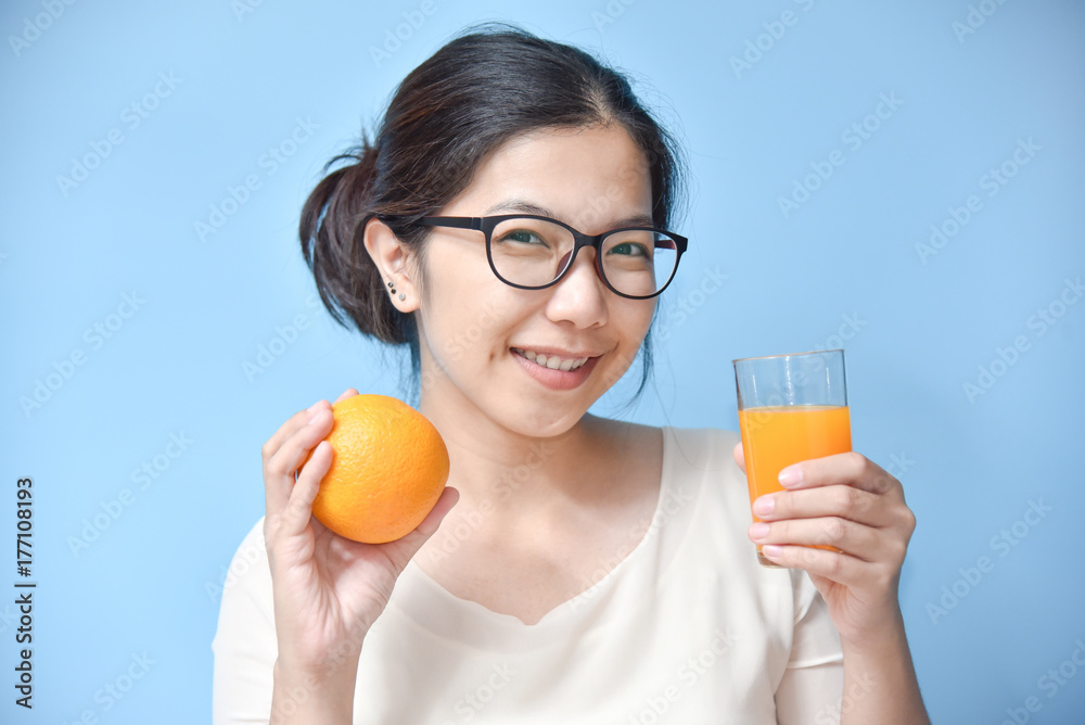 Woman holding orange with Orange juice. Woman holding orange with Orange juice.