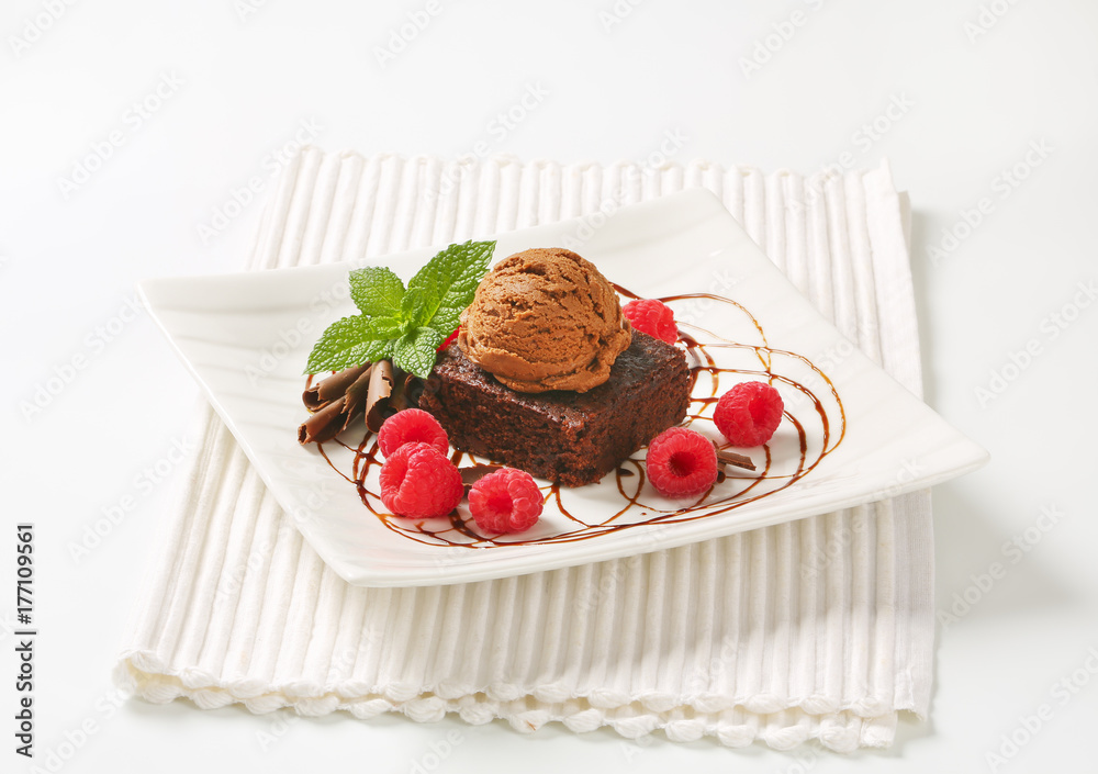Brownie with ice cream and raspberries Brownie with ice cream and raspberries