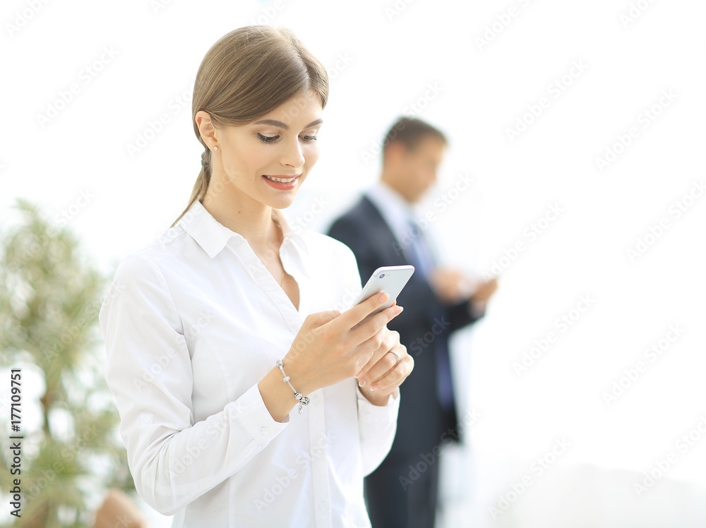 Closeup portrait young, shocked business woman, looking at cell phone Closeup portrait young, shocked business woman, looking at cell phone
