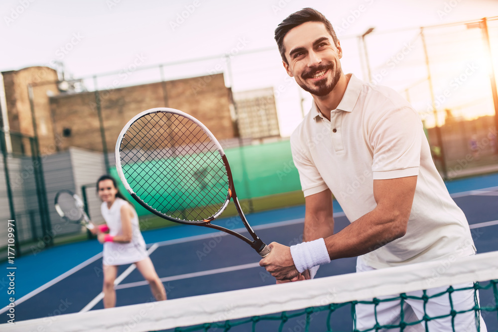 Couple on tennis court