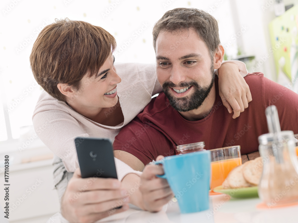 Couple taking selfies at home Couple taking selfies at home