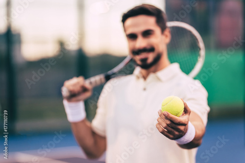 Man on tennis court