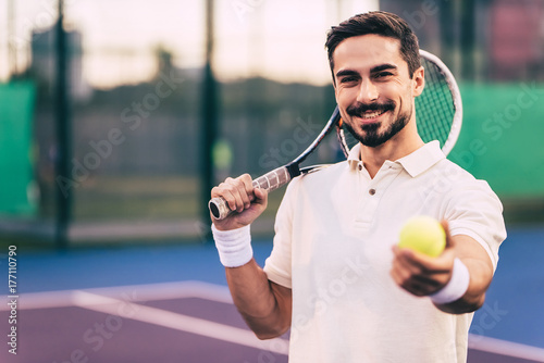 Man on tennis court © Vasyl