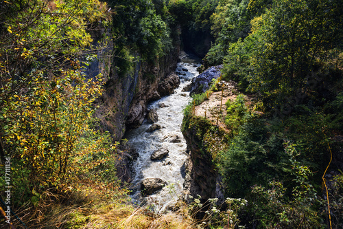 Mountain river in canyon, flowing water steam among nature landscape