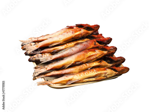 Lot of hot smoked river fish on tray isolated on white background. Delicious natural food background