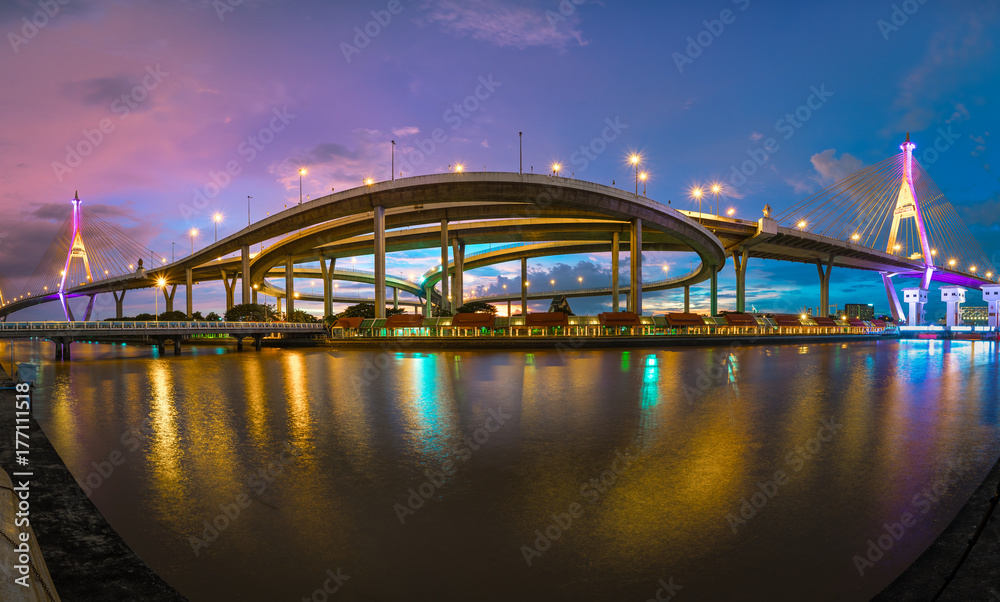 Panoramic view of Bhumibol Bridge, the Industrial Ring Road Bridge in the night scene after sunset. Twilight sky and light reflection on smooth water, Thailand Panoramic view of Bhumibol Bridge, the Industrial Ring Road Bridge in the night scene after sunset. Twilight sky and light reflection on smooth water, Thailand