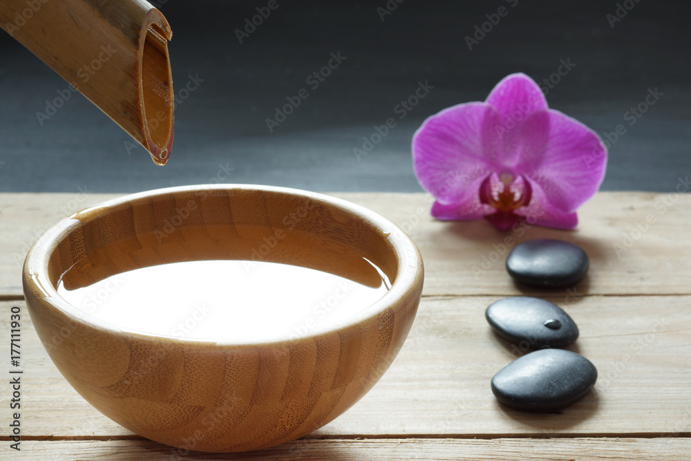 Set for spa procedures, stones for hot massage and flavored water, recruited from a bamboo stem into a bowl Set for spa procedures, stones for hot massage and flavored water, recruited from a bamboo stem into a bowl