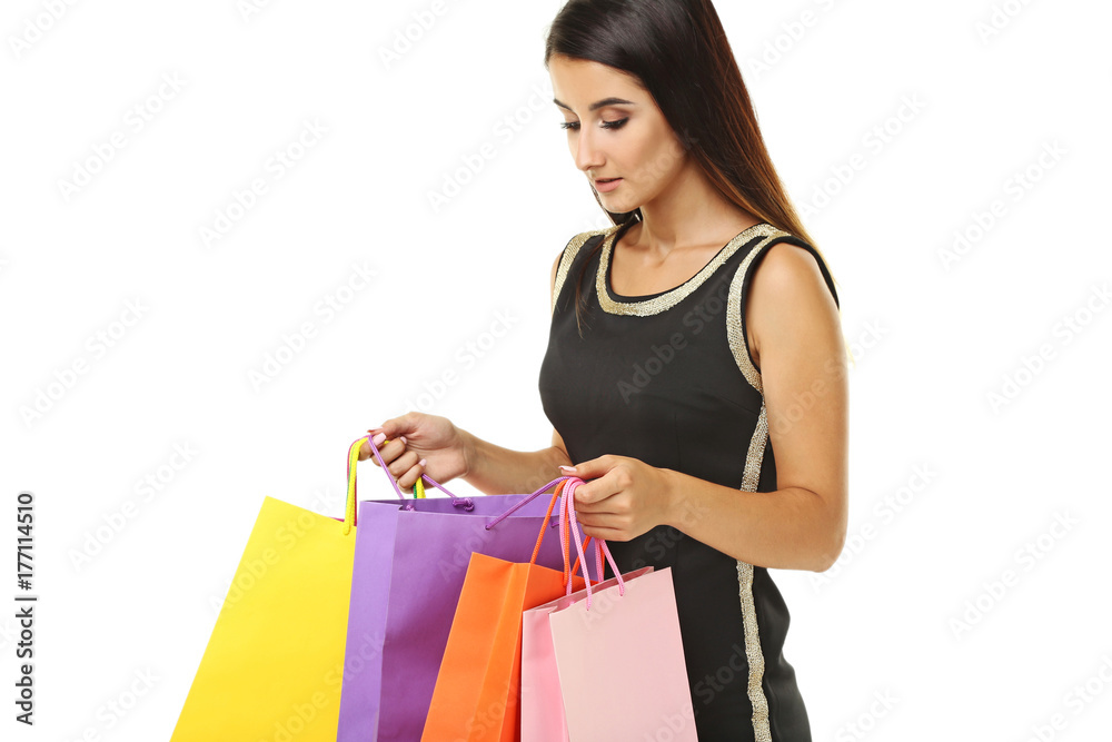 Young woman with shopping bags on white background Young woman with shopping bags on white background