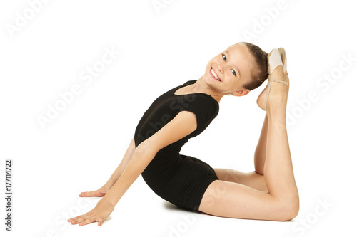 Young girl gymnast on white background