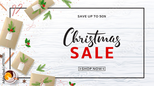 Christmas Sale Web Banner with Xmas Composition. Top View on Festive Decoration with Paper Gift Boxes for Happy New Year. Beautiful Card with Lettering. Vector Illustration with Discount Offer.
