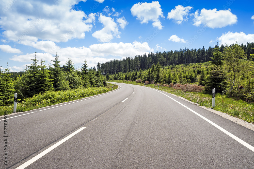 Fototapeta premium Curved road in green mountain scenery