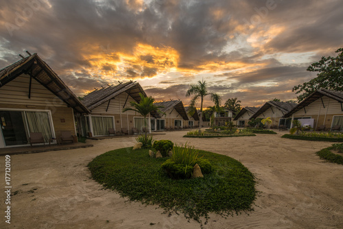 Small guest houses over a beautiful sunset. Philippines. The island of Palawan.
