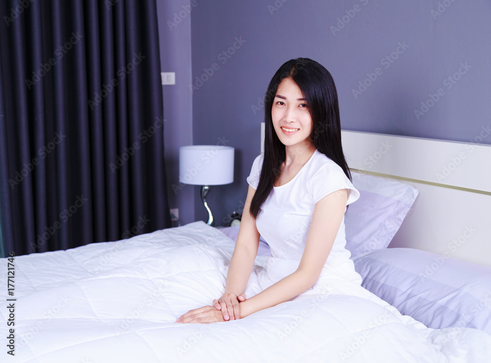 beautiful woman on bed in bedroom