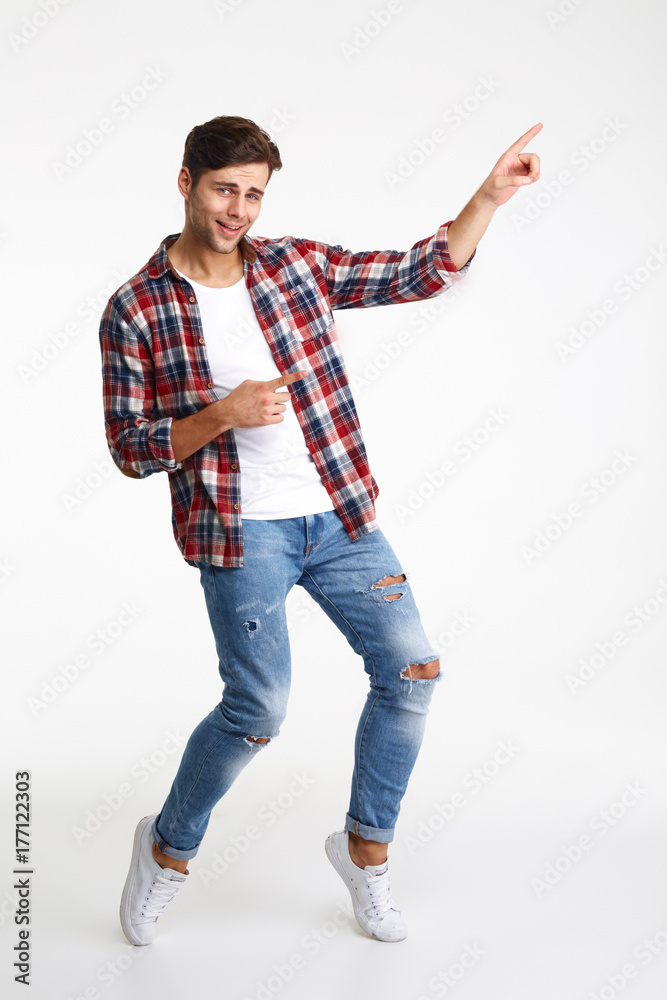 Full length portrait of a young smiling man Full length portrait of a young smiling man
