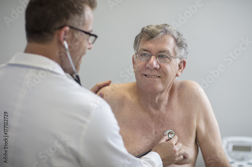Doctor examining senior patient in medical practice