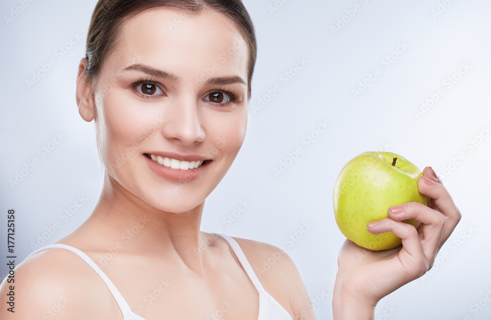 Smiling girl with apple Smiling girl with apple