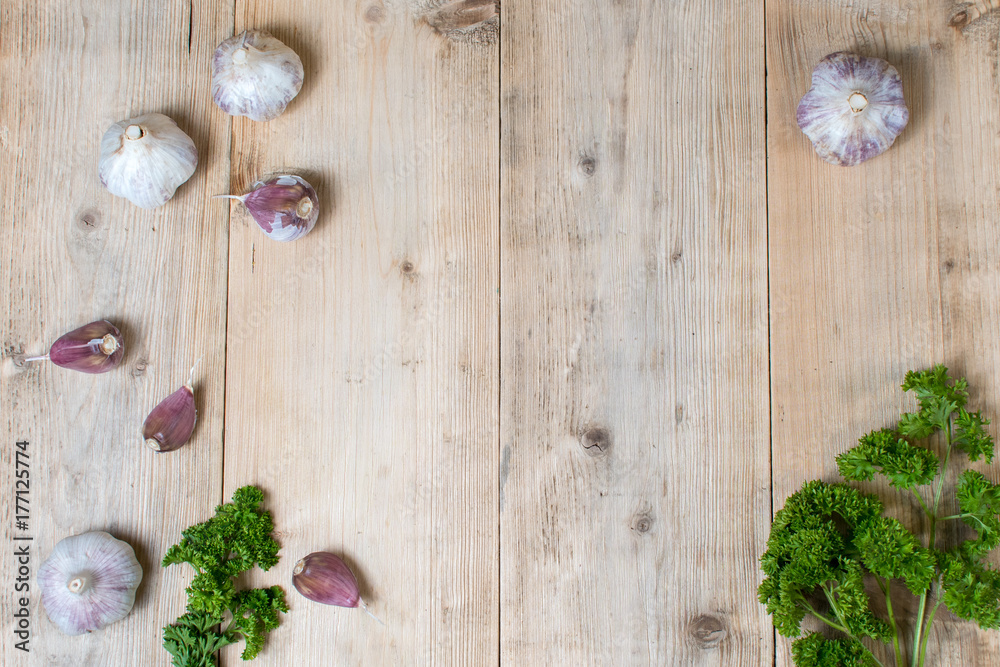 Fresh garlic on a wooden background