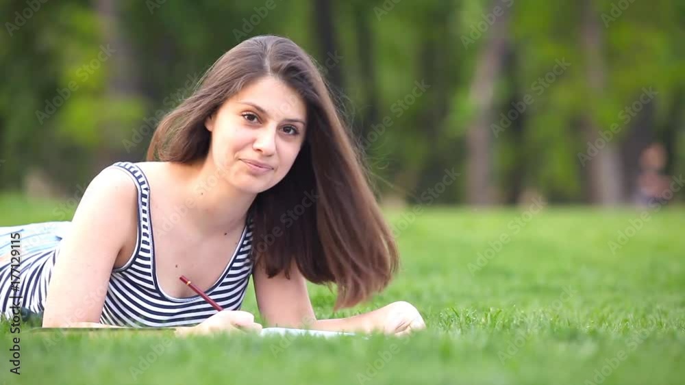 Young brunet girl with notebook at outdoor Young brunet girl with notebook at outdoor