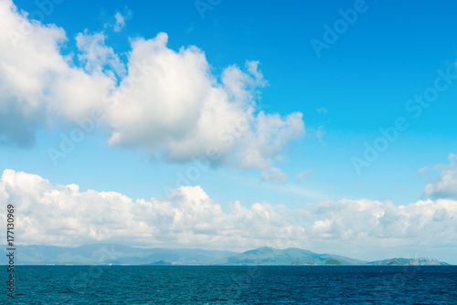 Seascape with green islands on horizon