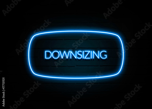 Downsizing - colorful Neon Sign on brickwall