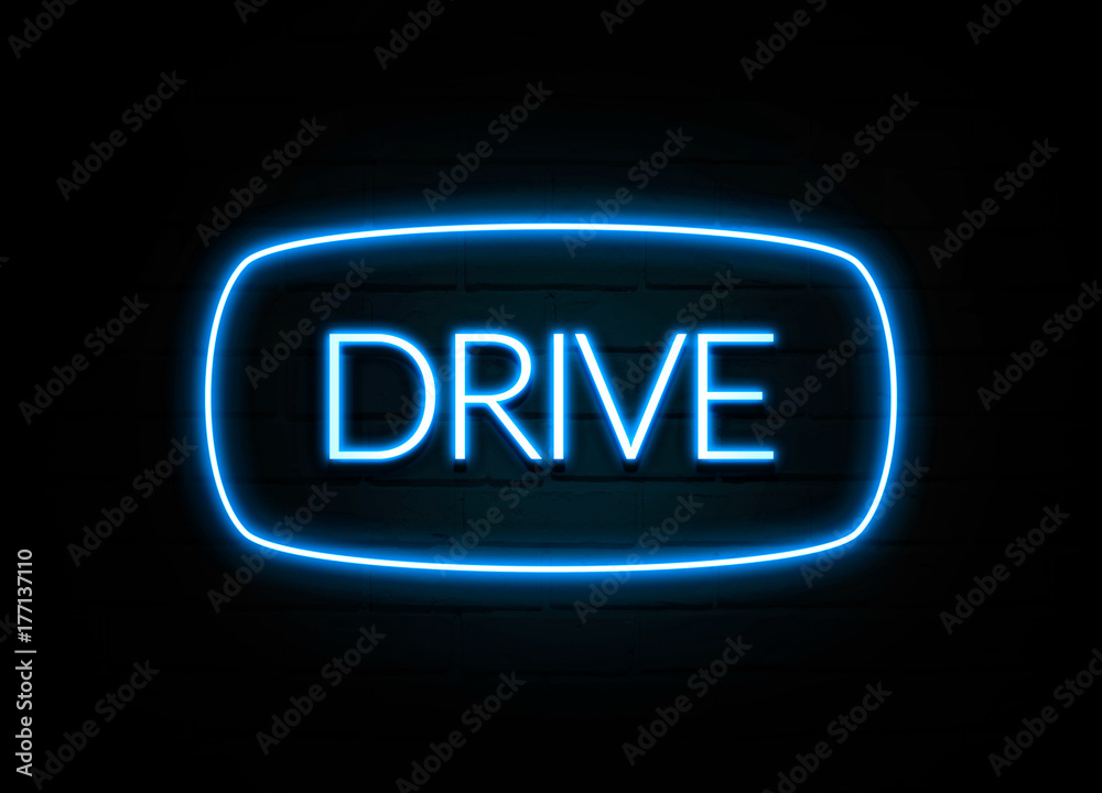 Drive - colorful Neon Sign on brickwall Drive - colorful Neon Sign on brickwall