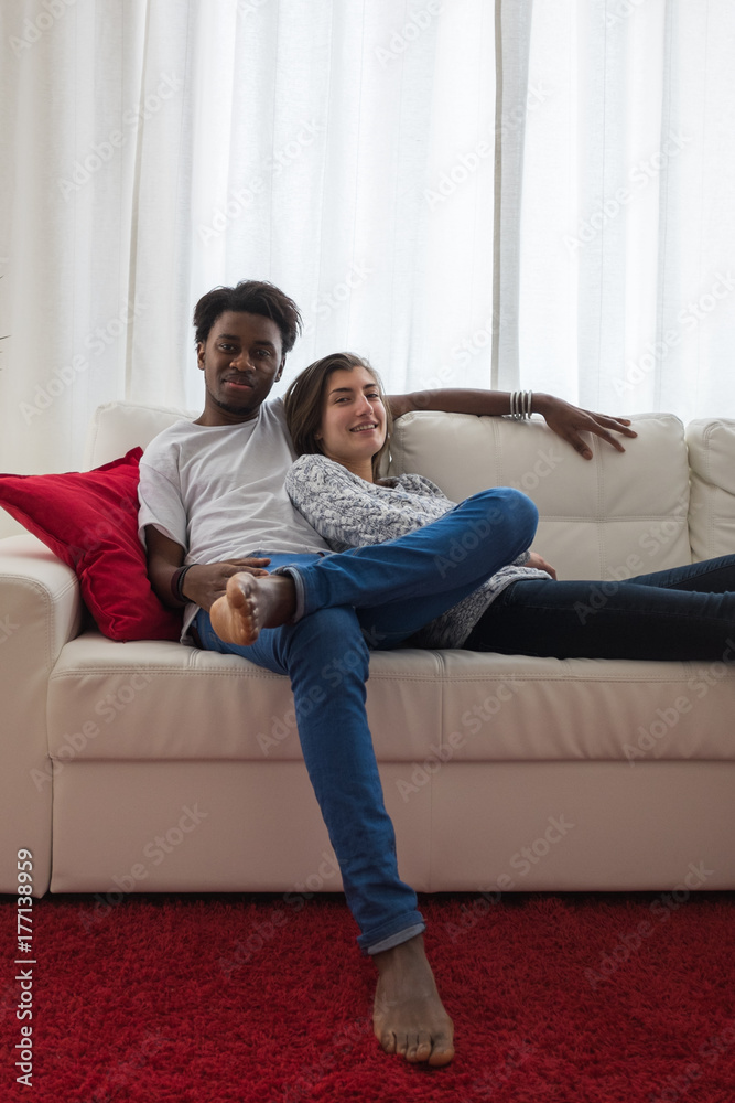 Lovely young couple relaxing at home Lovely young couple relaxing at home