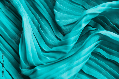 The texture of the mint pleated fabric. Blue georgette fabrics.