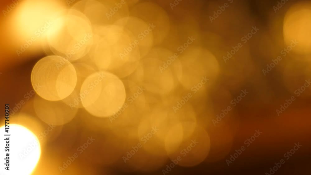 delicate yellow circle bokeh lights. computer generated loopable abstract motion background, slight film grain.