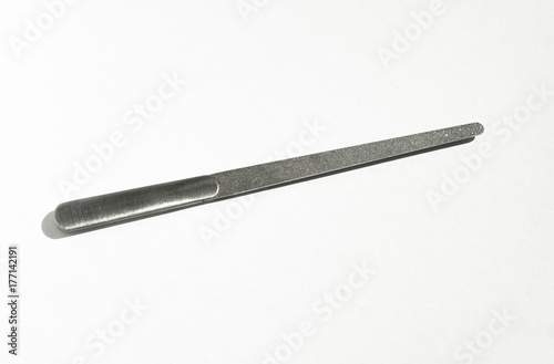 Stainless steel nail file. White background