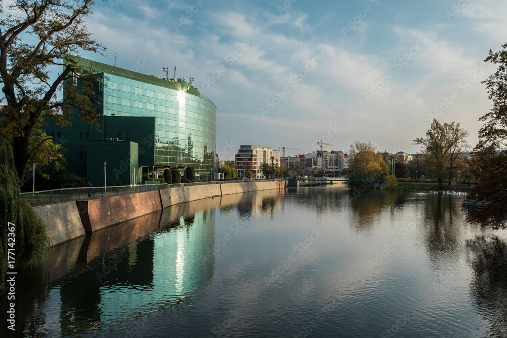 Fototapeta premium Buildings and Odra river at dawn in Wroclaw, Poland