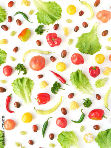 Food collage of fresh vegetables, top view. Corn, pepper, lettuce leaves, tomato isolated on white background. Abstract composition of vegetables. Concept of healthy eating. Food pattern, flat lay.